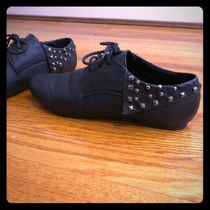 Black studded pointed toe oxfords
